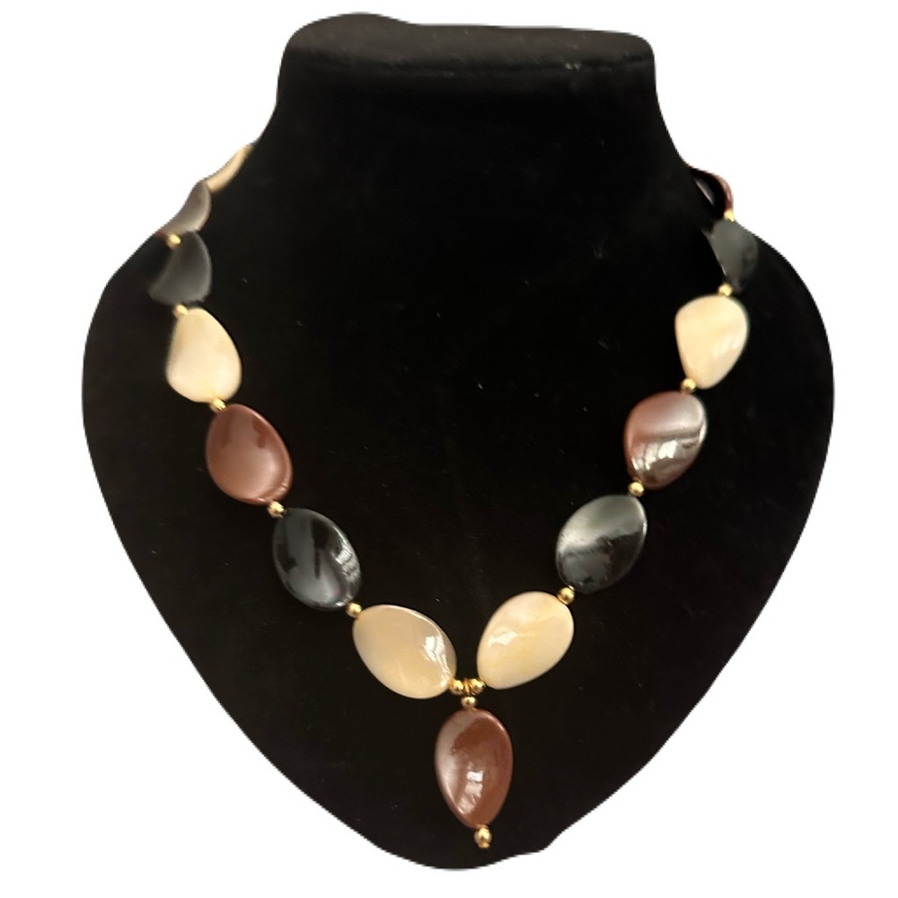 Vintage style disc necklace with gold accents.